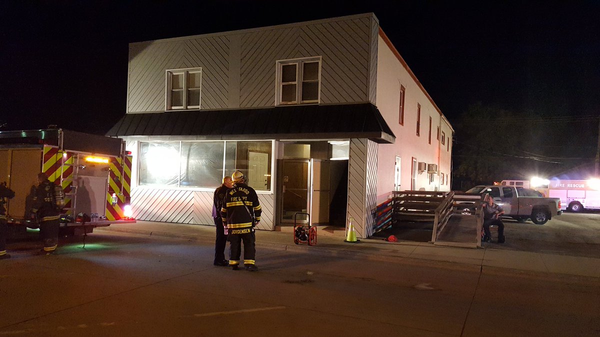 West Fargo firefighters on scene of fire in upstairs apt. 115 Main Ave. East.   