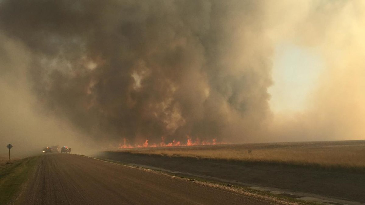 Heavy smoke from a wind-driven fire east of Gilby shut down a stretch of Grand Forks County Road 33 but caused little damage Tuesday afternoon.